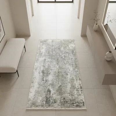 Image de Tapis moderne gris et crème, avec une texture abstraite et des franges. Dimensions : 80 x 150 cm