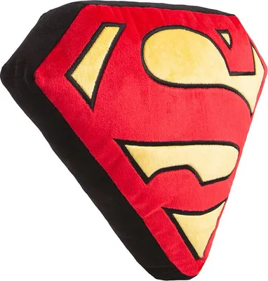 A close-up of a Superman logo pillow.