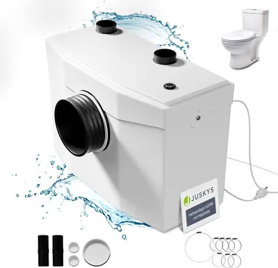 A white wastewater pump with a grinder is shown with water splashing around it, and a toilet in the background.