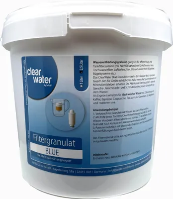 A white plastic bucket containing filter granules.