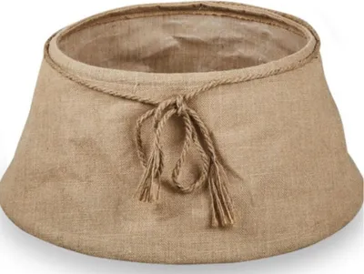 A close-up, studio shot of a beige jute Christmas tree skirt with a rope tie.
