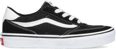 A side view of a black and white Vans sneaker against a white background.