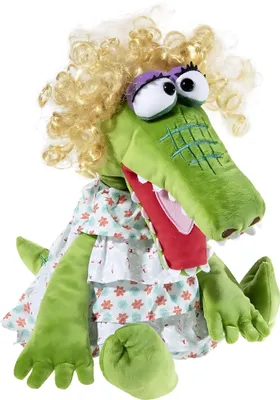 A stuffed toy alligator puppet with blonde curly hair and a floral dress.