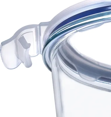 A close-up view of the lid and rim of a clear glass container with a blue and green striped accent.