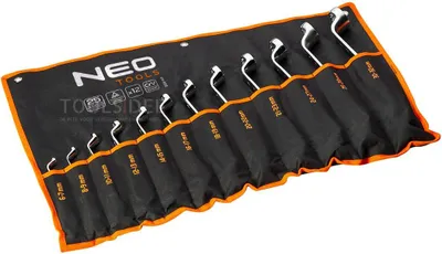 A set of wrenches laid out in a black fabric roll-up case.