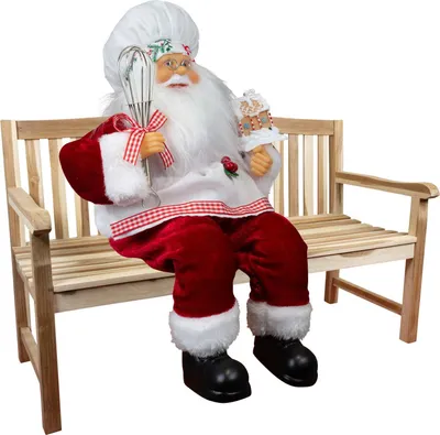 Produktbild von Weihnachtsmann Deko Figur Konditor Bäcker Nicolas 30cm Kantenhocker sitzend rot