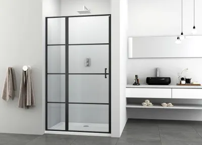 A modern bathroom with a black-framed glass shower door.