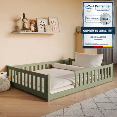 A child's bed with bedding in a room setting.