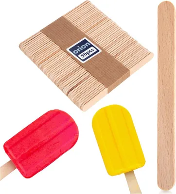 A collection of wooden popsicle sticks and two colorful popsicles.