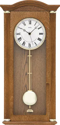 A wooden pendulum clock with a white face and Roman numerals.