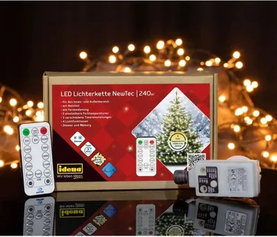 A product box for LED string lights, with two remote controls and the light controller unit displayed in front of it, set against a background of bokeh lights.