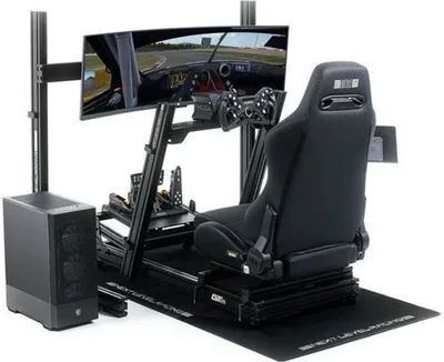 A racing simulator setup with a computer, monitor, steering wheel, pedals, and seat.