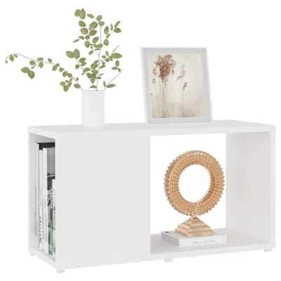 A white TV cabinet with decorative items on top and inside.
