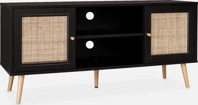 A black TV stand with cane doors and wooden legs against a white background.