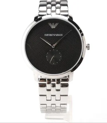 A close-up studio shot of an Emporio Armani watch against a white background.