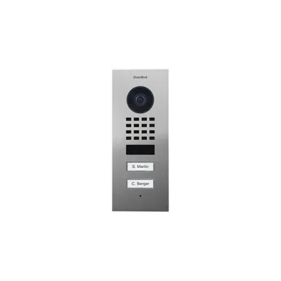 A DoorBird IP video door station with a camera, keypad, and nameplates, presented on a white background.