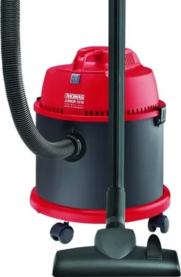 A red and black wet and dry vacuum cleaner with its hose and floor nozzle.