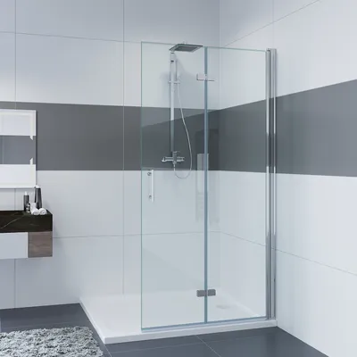 A modern bathroom with a glass shower enclosure.