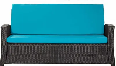 A studio shot of a dark brown wicker outdoor bench cushion with bright blue cushions.