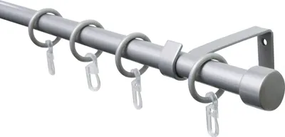 A close-up, angled view of a silver curtain rod with rings and clips, against a white background.