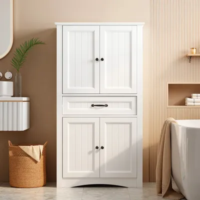 A white bathroom cabinet is shown in a bathroom setting, next to a bathtub and a laundry basket.