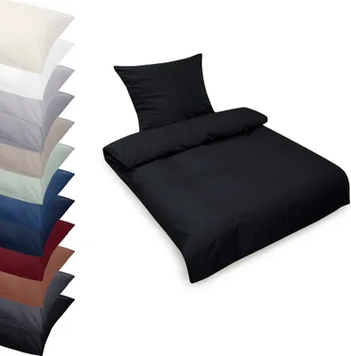 A black duvet cover and pillowcase set is displayed on a white background, with a stack of other colored bedding sets to the left.