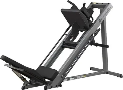 A Body-Solid GLPH1100B Kraftstation for leg press and hack squat exercises, shown against a white background.