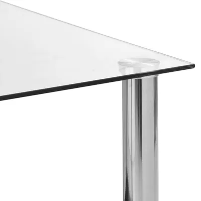 Close-up of a glass tabletop and a chrome table leg.