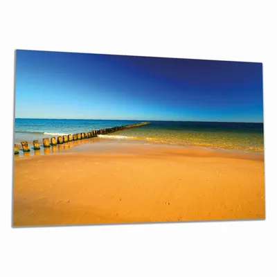 Produktbild von Wallario Herdabdeckplatte aus Glas, Größe 80 x 52 cm 1-teilig, Motiv Sandstrand in orange - Blaues Meer - Blauer Himmel