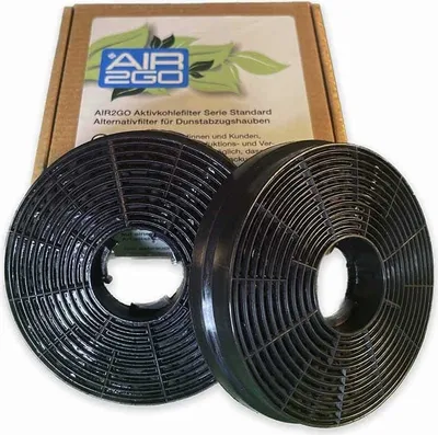 Two charcoal filters for a range hood are shown in front of their packaging.