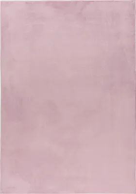 A close-up, full-frame shot of a pink rug.