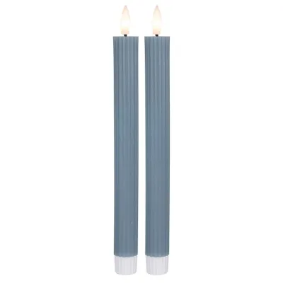 Two blue LED candles with white bases are shown against a white background.