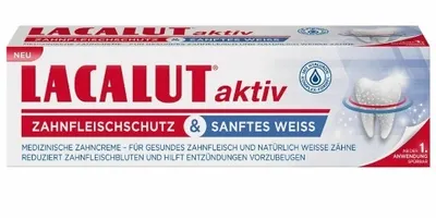A product shot of a toothpaste tube with marketing text and imagery.