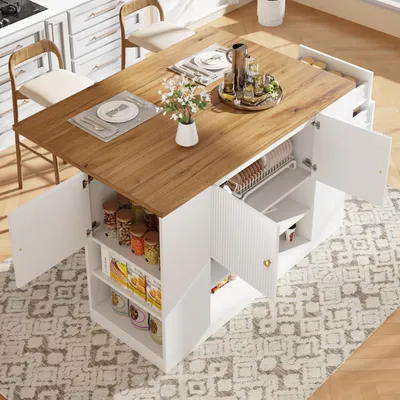 A kitchen island with a drop-leaf table, chairs, and storage cabinets, set up in a kitchen or dining area.