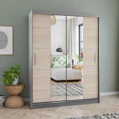 A wardrobe with mirrored doors is shown in a room setting, reflecting a sofa and a lamp.