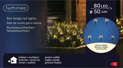 A close-up of a box hedge with net lights, showcasing the product's illumination.