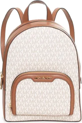 A white Michael Kors backpack with brown trim and straps, set against a white background.