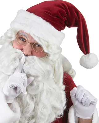 A close-up of Santa Claus wearing a red and white hat, holding a finger to his lips in a 'shushing' gesture.