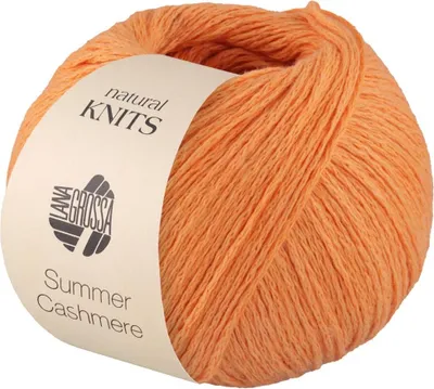 A ball of orange yarn with a label.