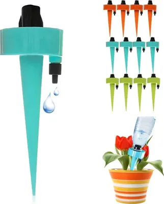 A collection of automatic plant watering devices and a potted plant with tulips.