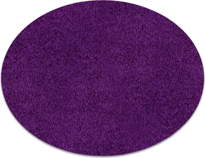 A round purple rug on a white background.