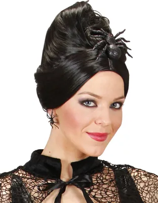 A woman wearing a black lace outfit and a black wig with a spider hair clip and spider earrings.