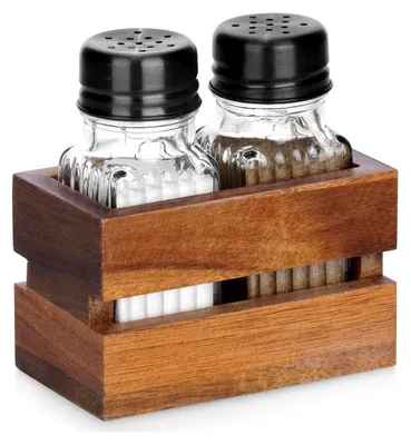 A set of salt and pepper shakers in a wooden holder.