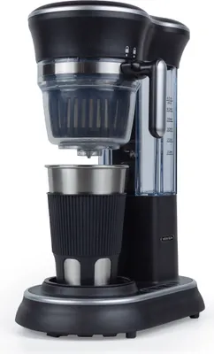 A black and silver coffee maker with a stainless steel mug.