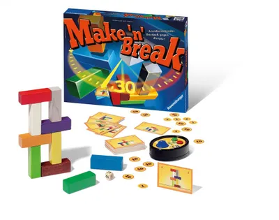 A board game and its components are laid out on a white surface.