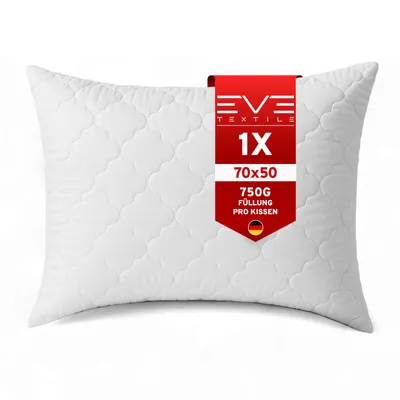 A white quilted pillow with a red tag showing product details.