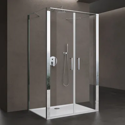 A modern shower cabin with glass doors and chrome fixtures, set against a textured dark gray wall.