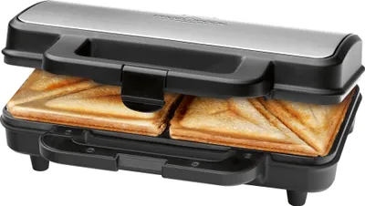 A sandwich maker with two toasted sandwiches inside, shown from a diagonal front view.