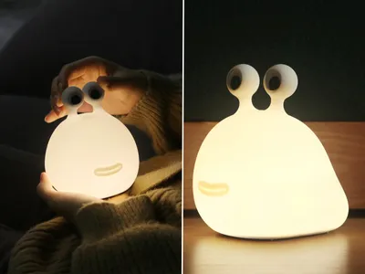 A collage showing a cute, glowing slug-like lamp. The left side shows it being held by hands in a dark room, while the right side shows it on a wooden surface in a dimly lit room.