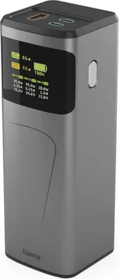 A gray power bank with a digital display showing charging information.